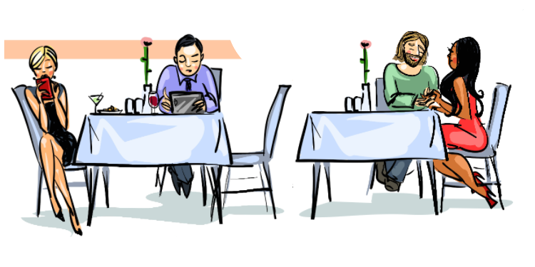 couple on their phones next to attentive couple in a restaurant