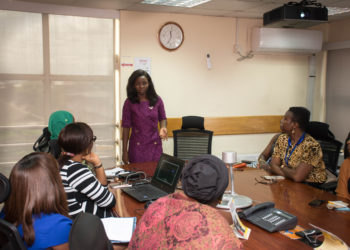Tomie Balogun teaching an investment workshop