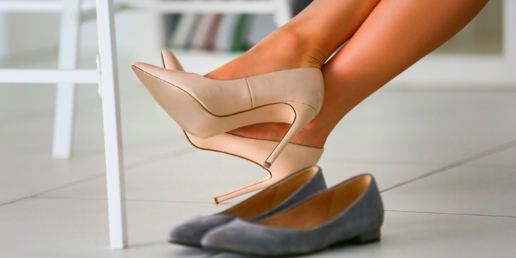 woman wearing heels next to flats