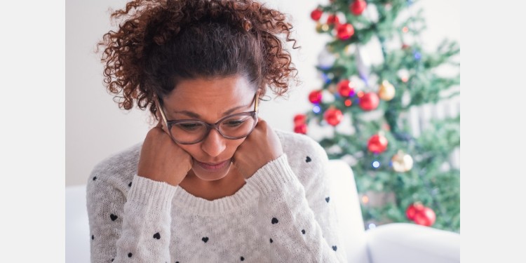 black woman sad during the Christmas holidays
