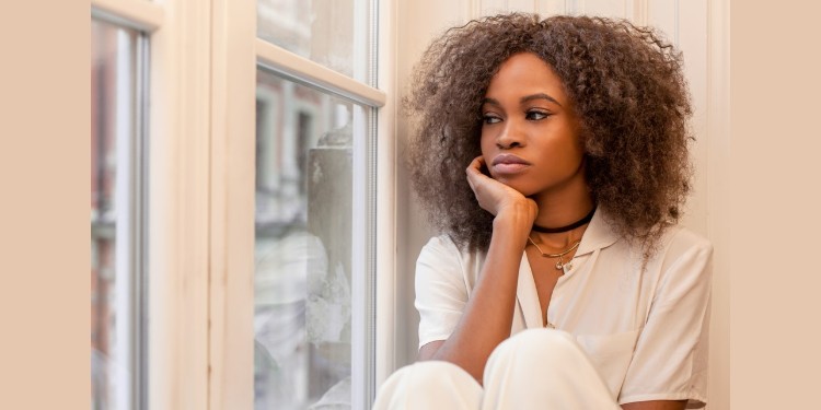 young woman reflecting over lost relationship