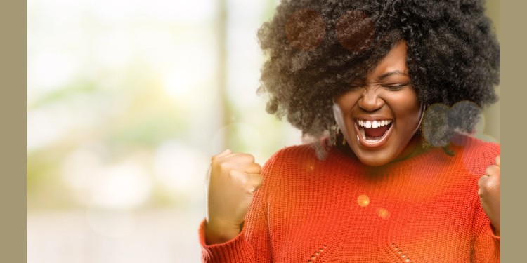 Black woman rejoicing over new job