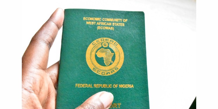 Woman holding Nigerian passport