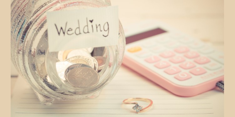 Image of wedding savings jar and calculator