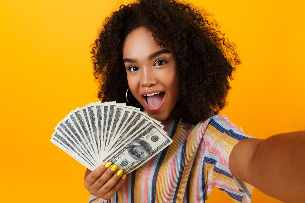 Woman excited to hit her money goals