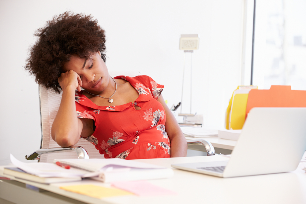 Woman feeling tired at work