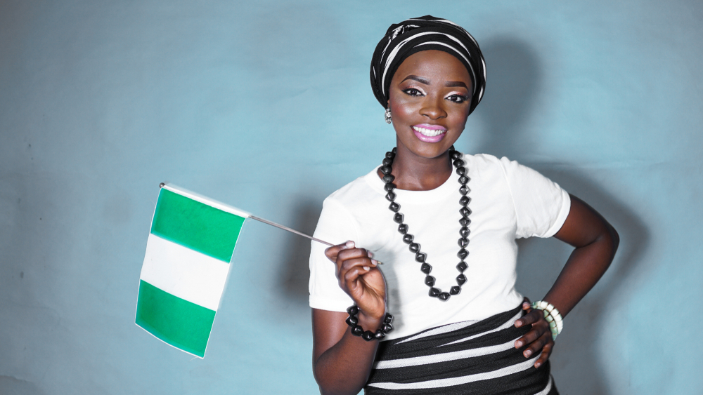 Woman holding the Nigerian flag