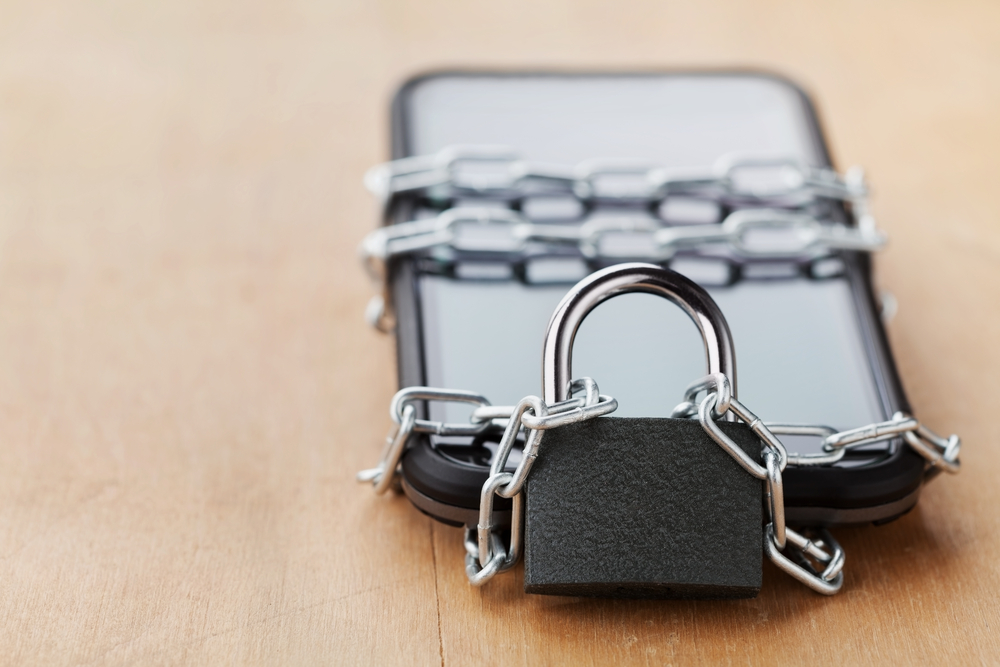 Image of locked phone depicting social media ban