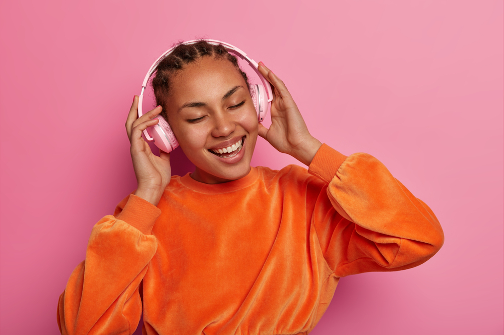 Happy woman listening to music