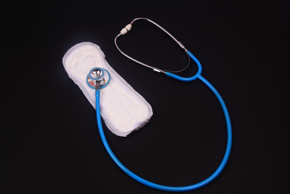 Stethoscope placed on top of a sanitary pad