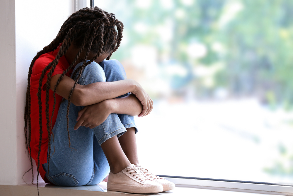 Black girl child feeling bad for being bullied