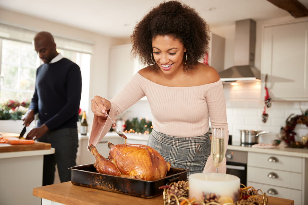 Woman cooking with her husband during the holidays